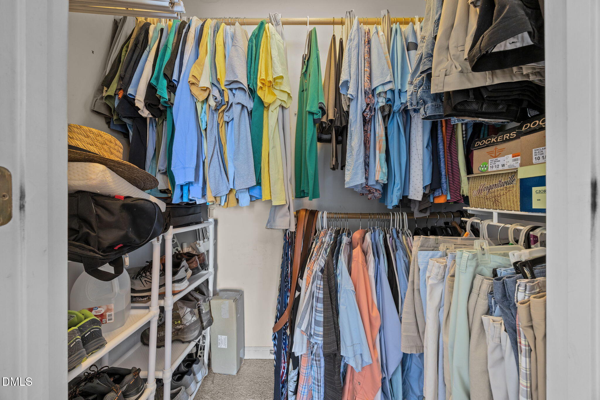 30 Stockton Drive Angier, NC 27501 - Photo 40 of 52 a view of walk in closet with clothes and shoes