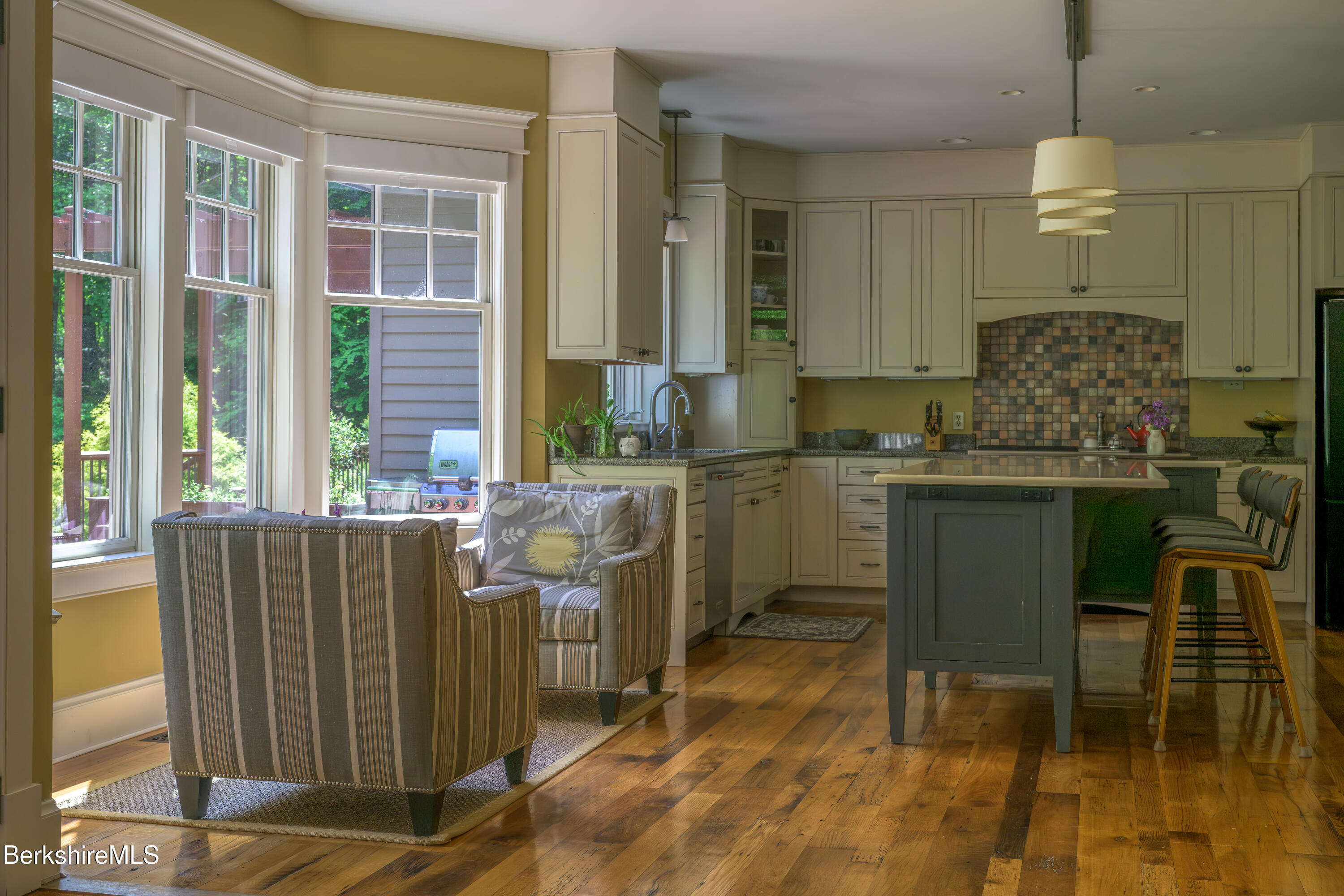 430 Lenox Road Richmond, MA 01254 - Photo 15 of 66 a kitchen with a table chairs sink and cabinets
