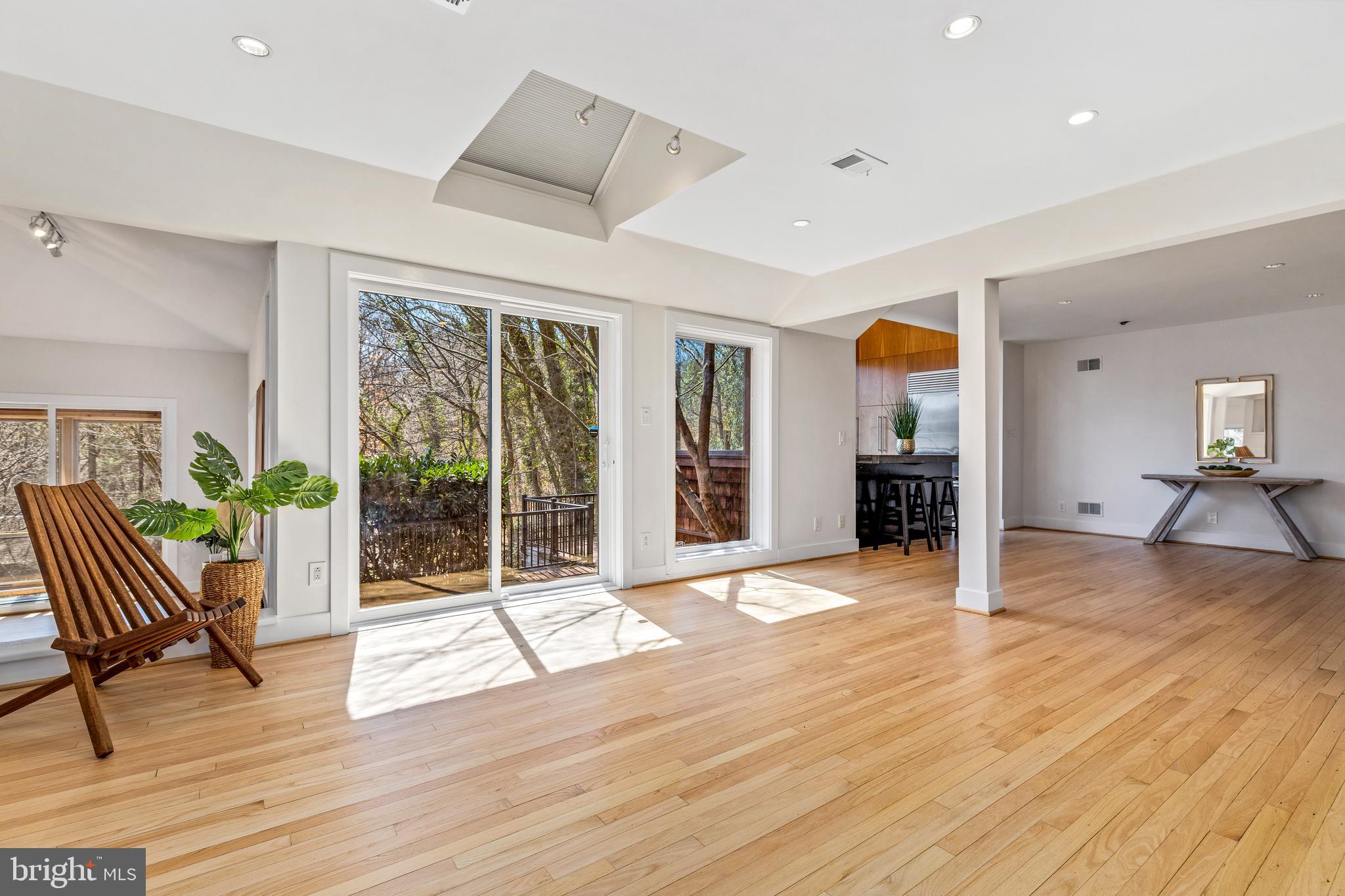 2609 Klingle Road Northwest Washington, DC 20008 - Photo 11 of 41 a view of an empty room with wooden floor and a window