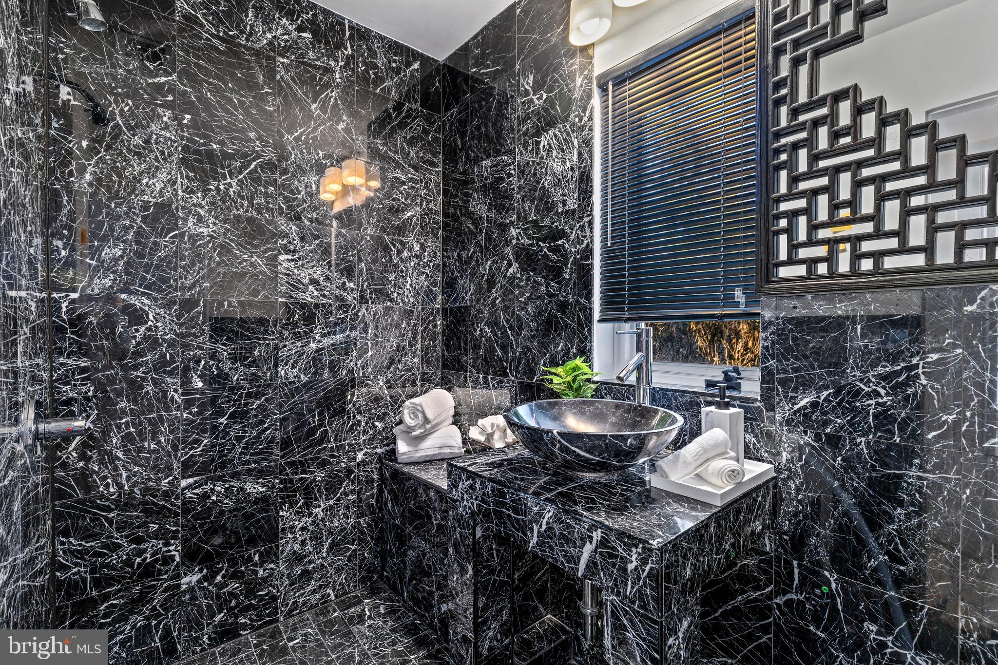 2609 Klingle Road Northwest Washington, DC 20008 - Photo 21 of 41 a view of a house with patio and a yard