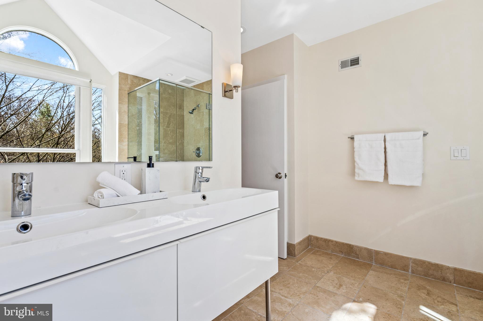 2609 Klingle Road Northwest Washington, DC 20008 - Photo 25 of 41 a bathroom with a sink and a mirror