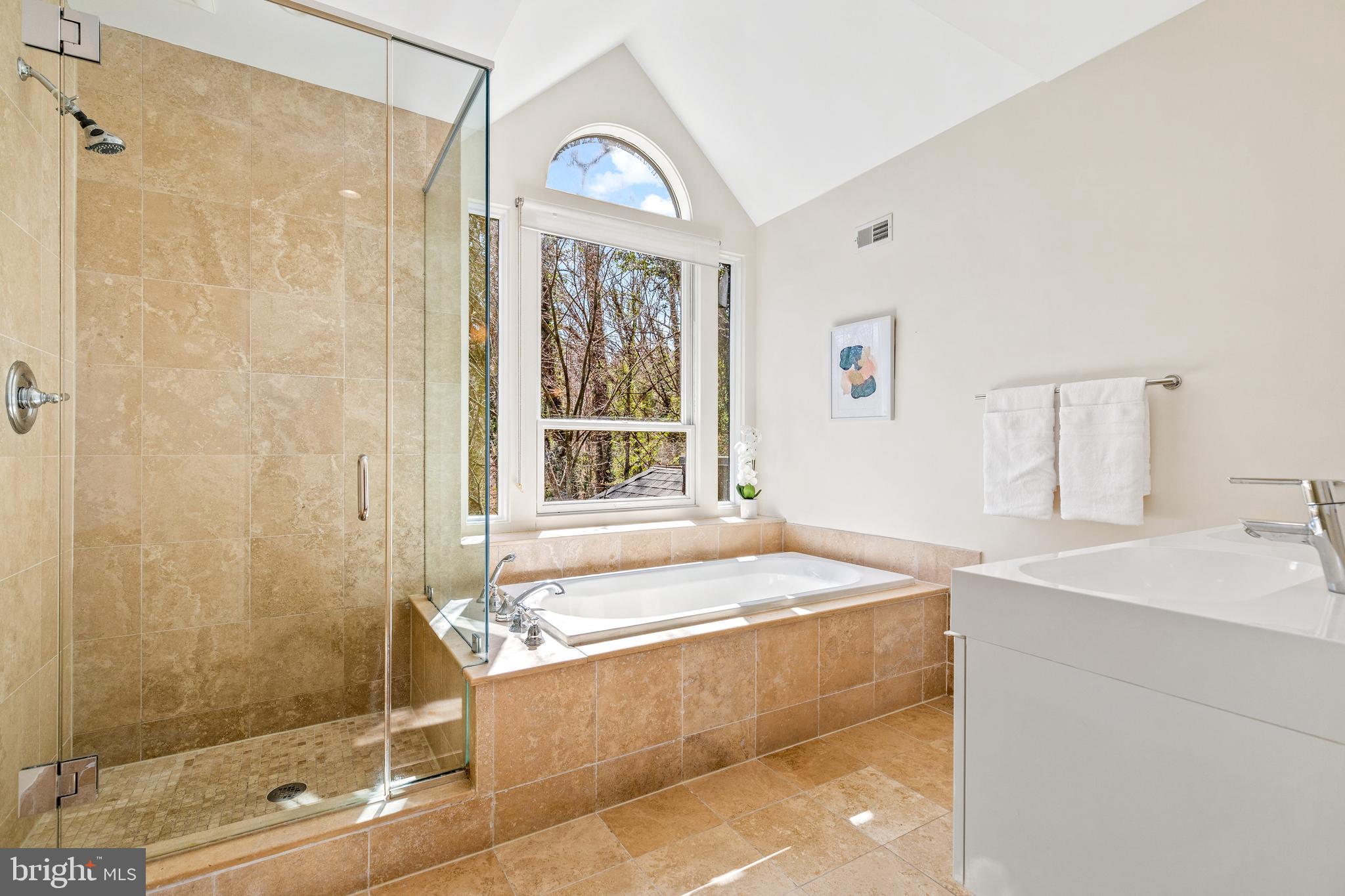 2609 Klingle Road Northwest Washington, DC 20008 - Photo 26 of 41 a bathroom with a tub sink and shower