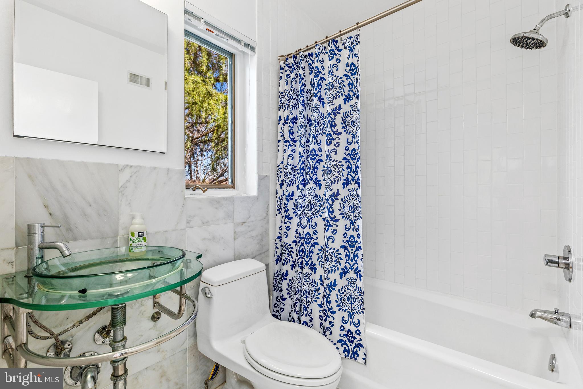 2609 Klingle Road Northwest Washington, DC 20008 - Photo 30 of 41 a bathroom with a sink toilet and shower
