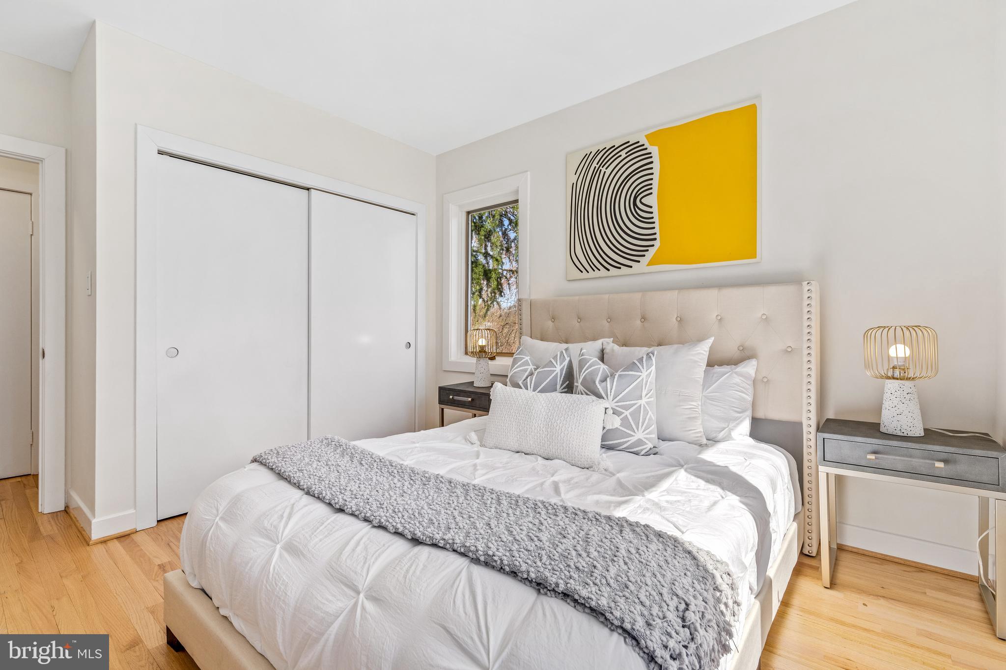 2609 Klingle Road Northwest Washington, DC 20008 - Photo 32 of 41 a bedroom with a bed and painting on the wall