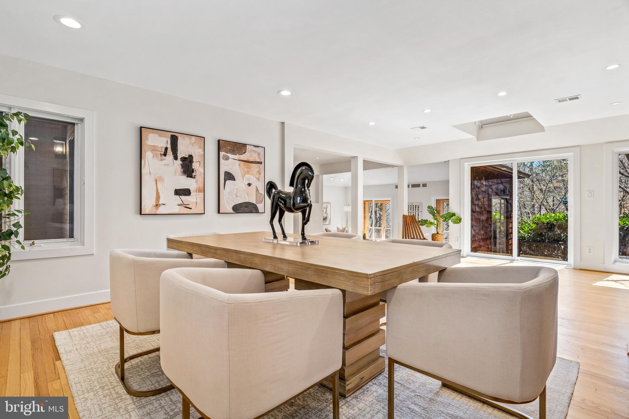 2609 Klingle Road Northwest Washington, DC 20008 - Photo 6 of 41 a living room with furniture a large window and wooden floor