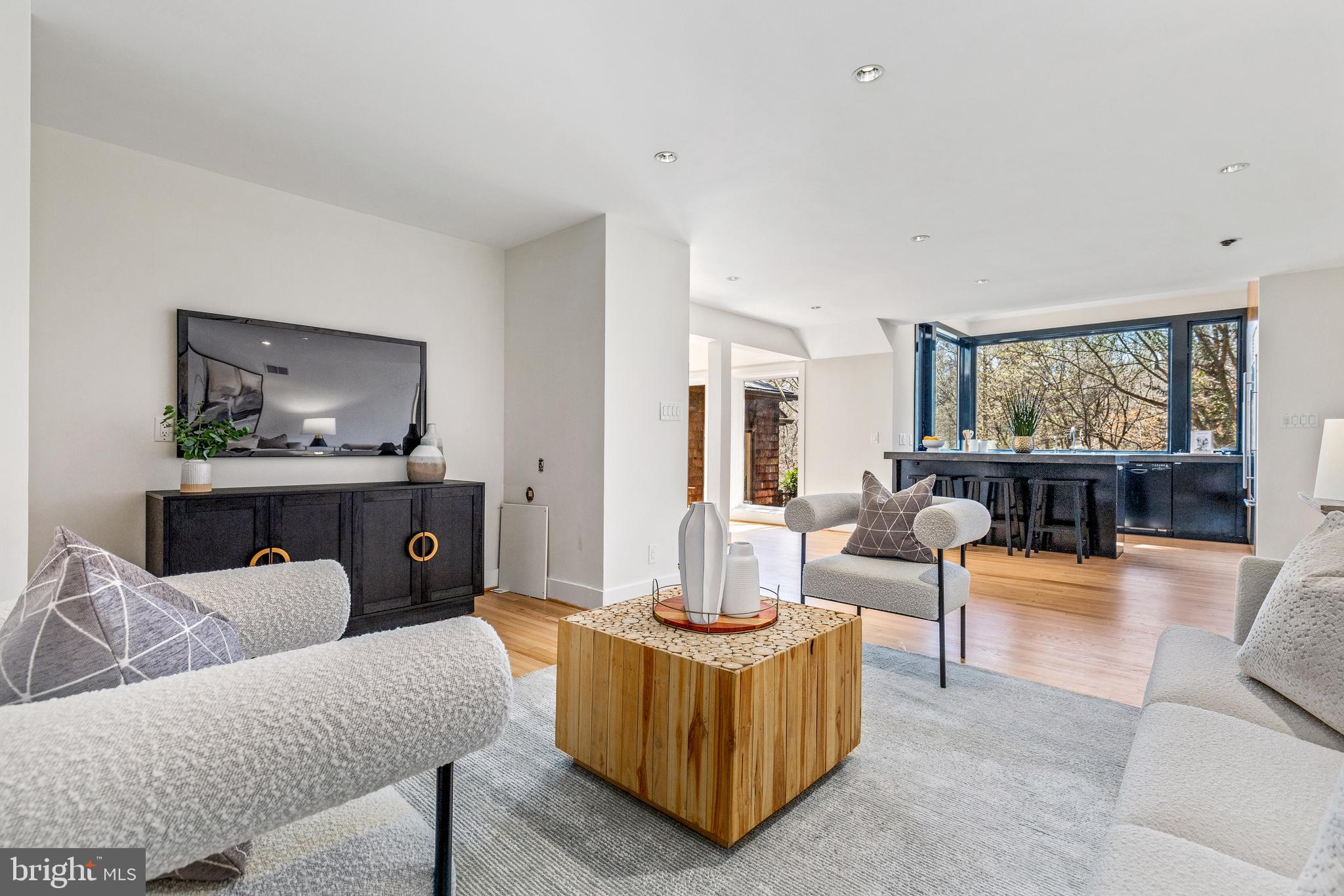 2609 Klingle Road Northwest Washington, DC 20008 - Photo 8 of 41 a living room with furniture and a flat screen tv