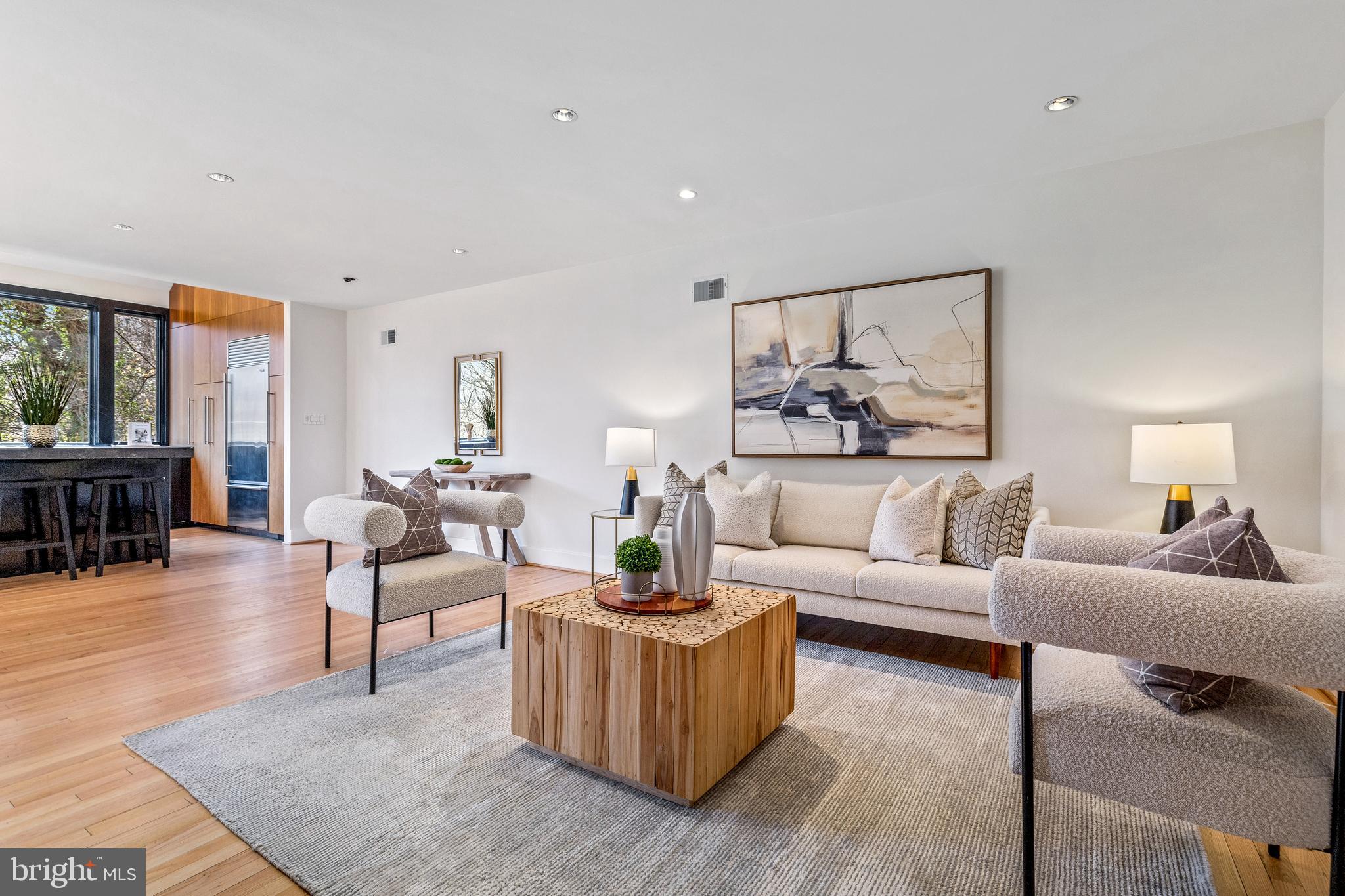 2609 Klingle Road Northwest Washington, DC 20008 - Photo 9 of 41 a living room with furniture and a large mirror next to a window