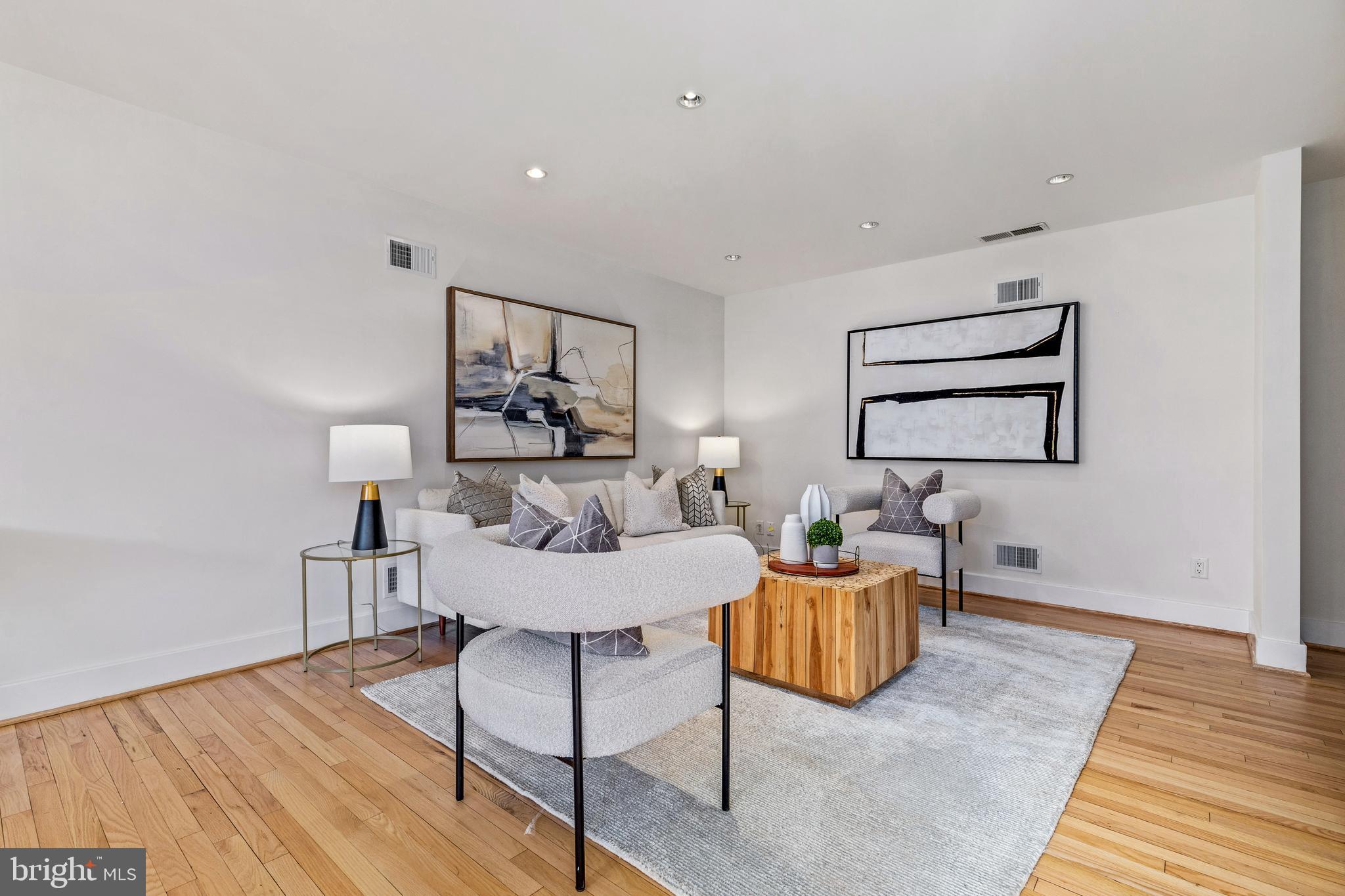 2609 Klingle Road Northwest Washington, DC 20008 - Photo 10 of 41 a living room with furniture and a wooden floor