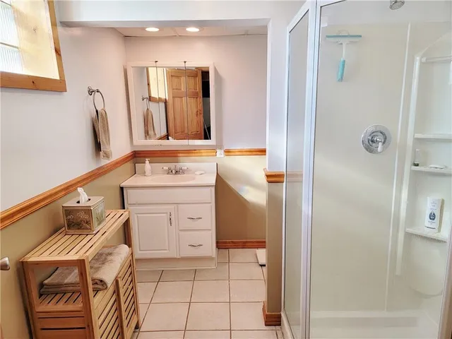 a bathroom with a sink a vanity and a mirror