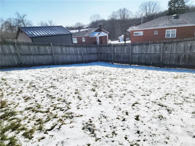 a view of a backyard of a house