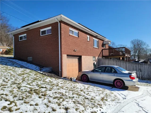a front view of a house with parking yard