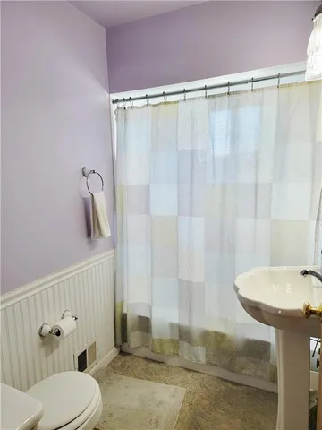 a bathroom with a sink and toilet