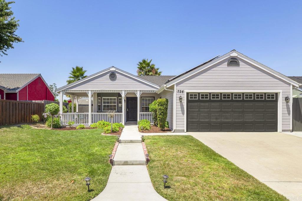 724 Hollowglen Road Oceanside, CA 92057 - Photo 1 of 1 a front view of house with yard and green space