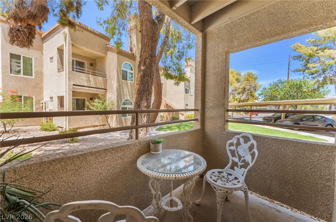 3145 East Flamingo Road, Unit 1092 Las Vegas, NV 89121 - Photo 8 of 33 A tranquil balcony provides a private outdoor retreat with a scenic view of the community.