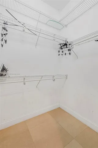 a backyard of a house with a yard and outdoor seating