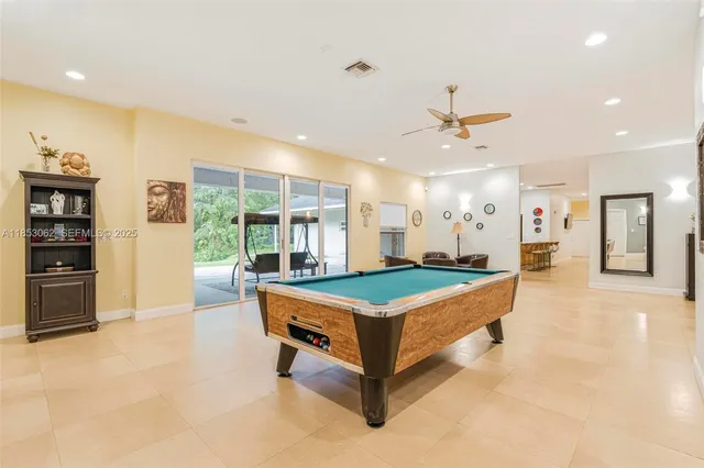 a kitchen with a table and chairs in it