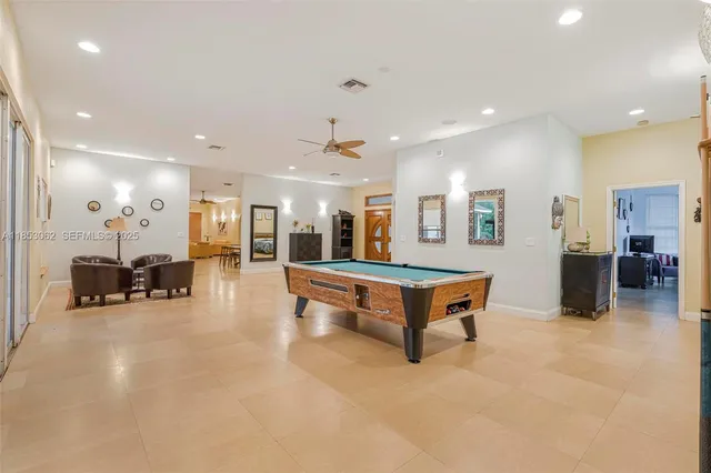 a bedroom with a bed and a dresser with rug