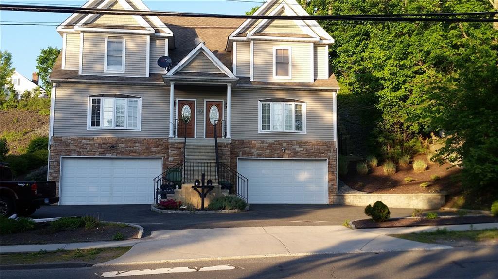 30 Coalpit Hill Road, Unit 1 Danbury, CT 06810 - Photo 1 of 1 a view of a house with a patio
