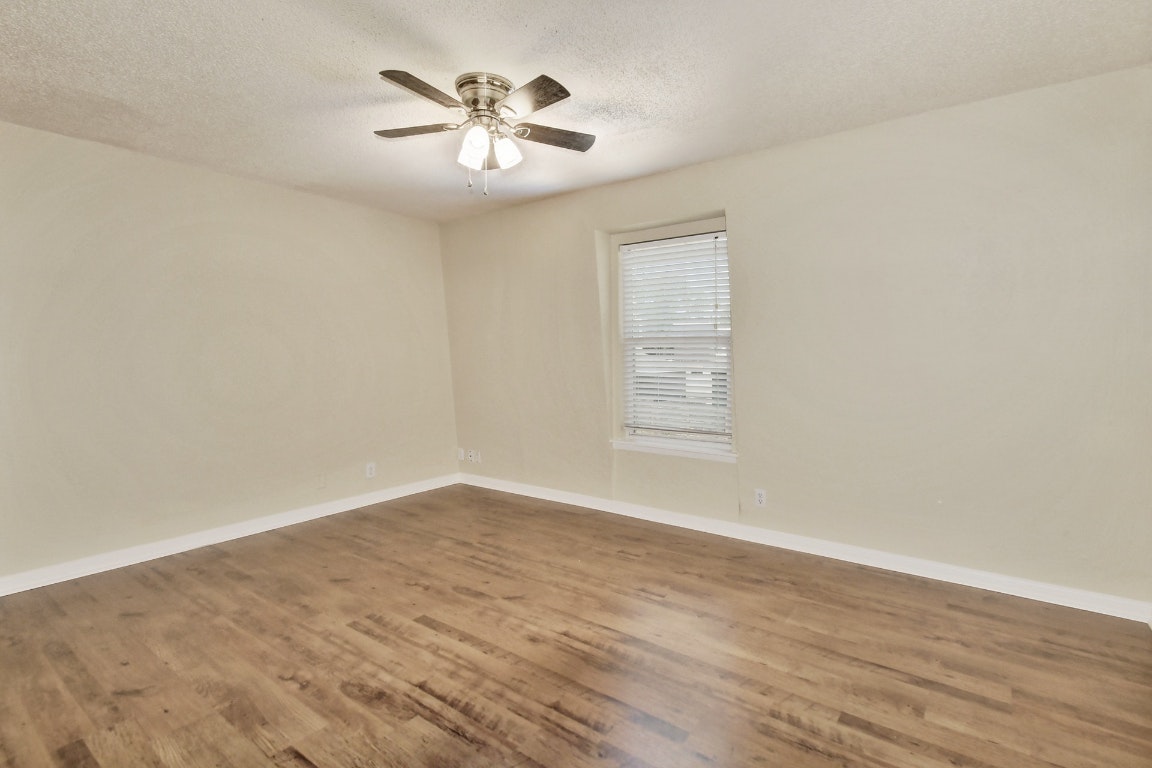 1704 East M. Franklin Avenue, Unit B Austin, TX 78721 - Photo 15 of 26 a view of an empty room with a window