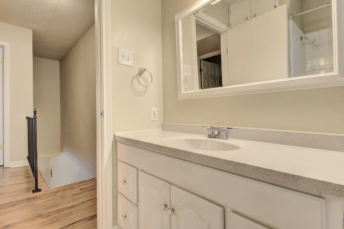 1704 East M. Franklin Avenue, Unit B Austin, TX 78721 - Photo 17 of 26 a bathroom with a sink and a mirror