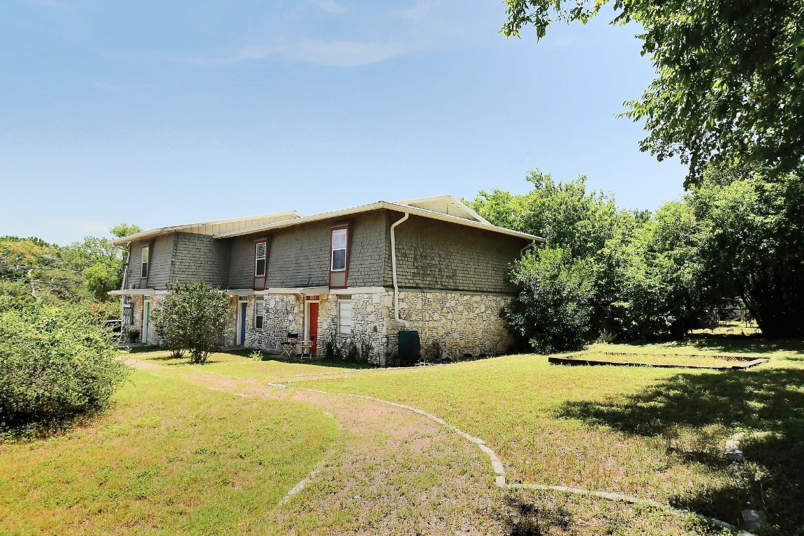 1704 East M. Franklin Avenue, Unit B Austin, TX 78721 - Photo 26 of 26 a front view of a house with a yard