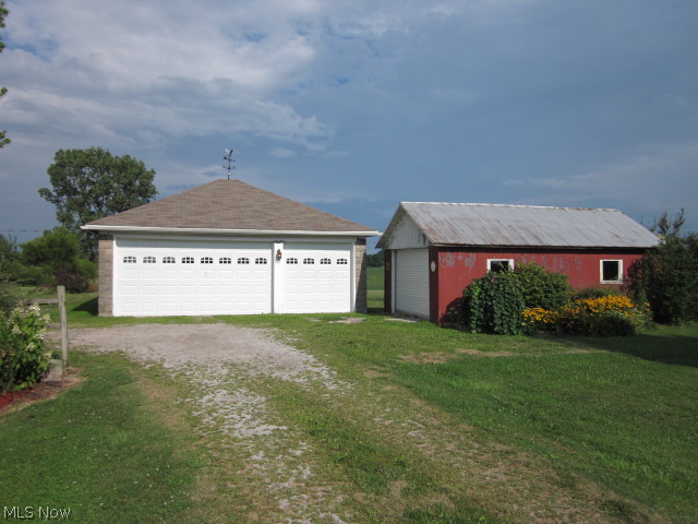 13404 Butler Road Wakeman, OH 44889 - Photo 3 of 25 3 Car garage with newer doors plus another garage with room for more!