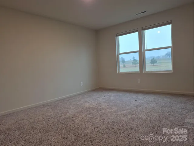 a bedroom with a bed and a desk