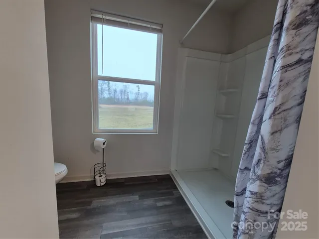 a view of a bathroom with a sink and a mirror