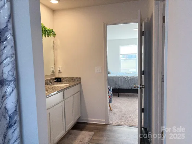 a view of a living room with furniture and a rug