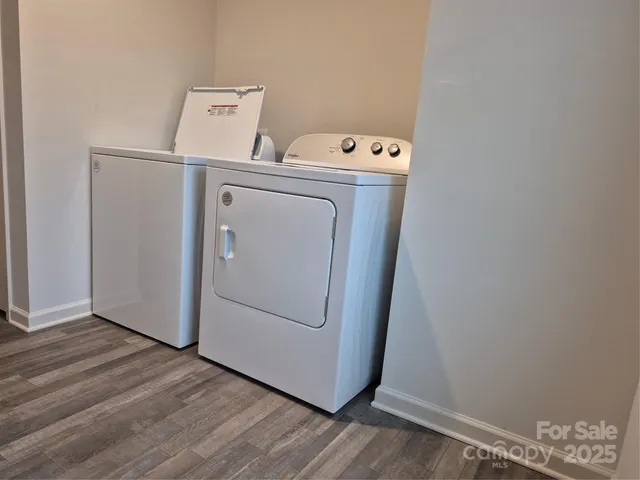 a view of a backyard with table and chairs