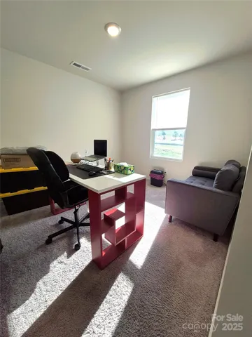 a workspace with furniture and window