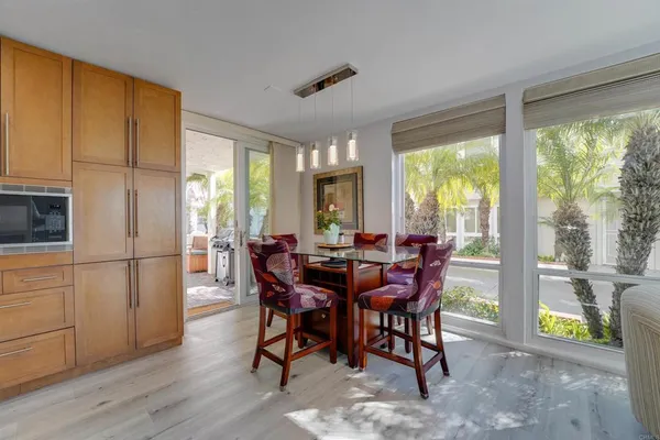 a view of a dining room with furniture window and outside view