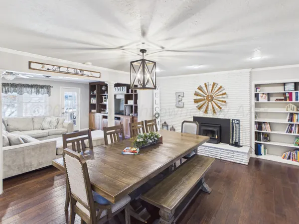 a kitchen with lots of counter top space and furniture
