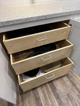 a kitchen with a refrigerator and a sink