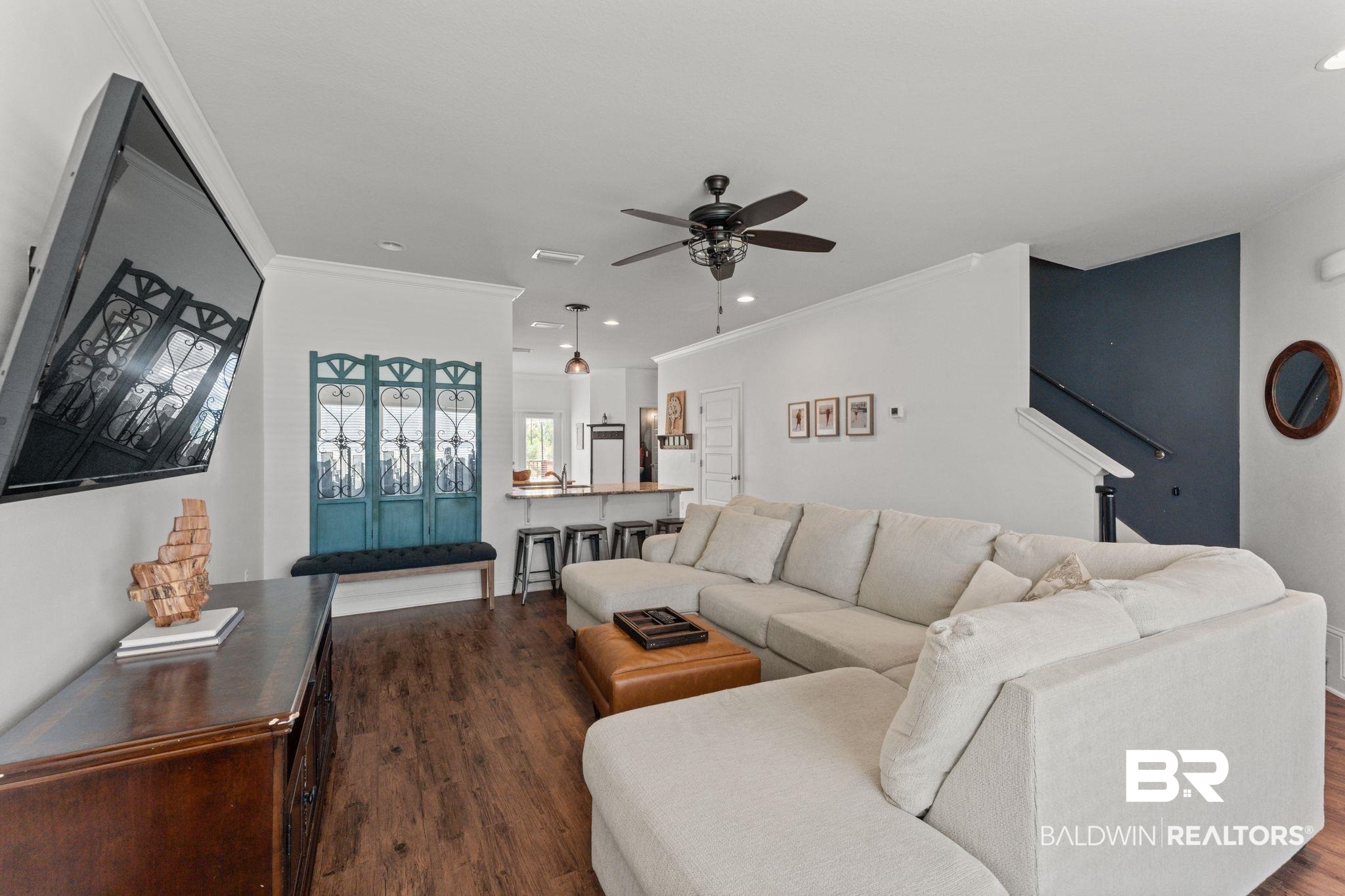 12711 Chickadee Lane Daphne, AL 36527 - Photo 5 of 39 Living area with dark wood finished floors, ornamental molding, stairway, recessed lighting, and ceiling fan