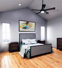 1213 Eleanor Street, Unit A Austin, TX 78721 - Photo 5 of 6 a bedroom with a bed and a painting on the wall