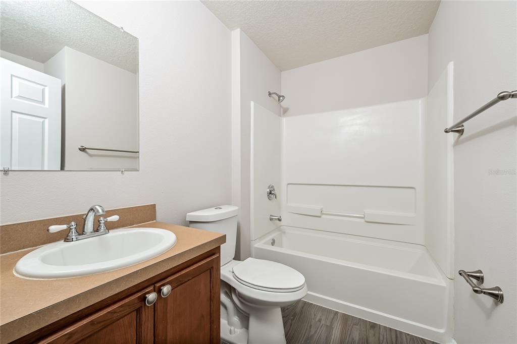 149 Springberry Court Daytona Beach, FL 32124 - Photo 13 of 16 a bathroom with a sink toilet and shower
