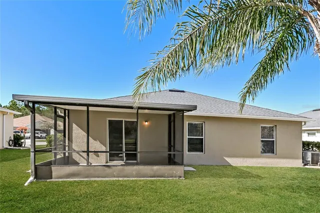 a front view of a house with a yard and porch