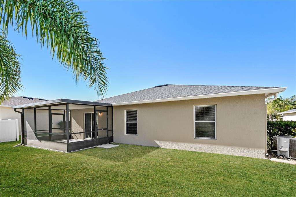 149 Springberry Court Daytona Beach, FL 32124 - Photo 15 of 16 a view of a house with a yard and a porch