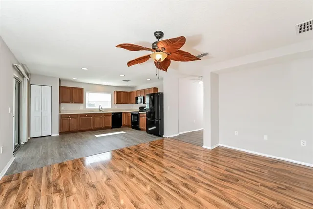 a view of a kitchen with a sink and a kitchen floor
