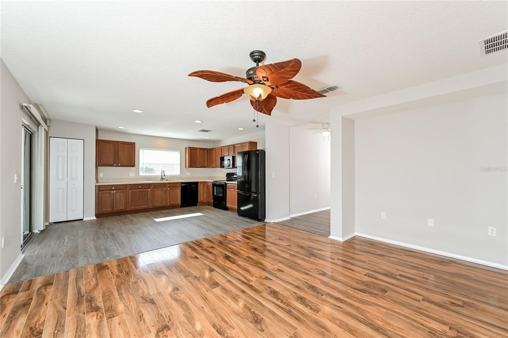 149 Springberry Court Daytona Beach, FL 32124 - Photo 2 of 16 a view of a kitchen with a sink and a kitchen floor