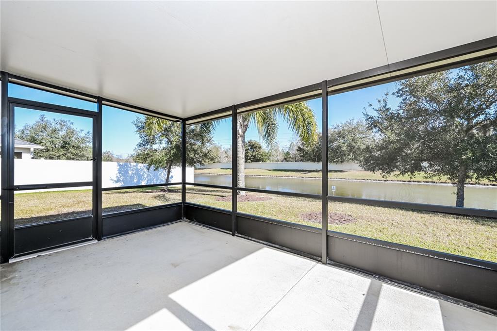 149 Springberry Court Daytona Beach, FL 32124 - Photo 5 of 16 a view of an empty room with large windows