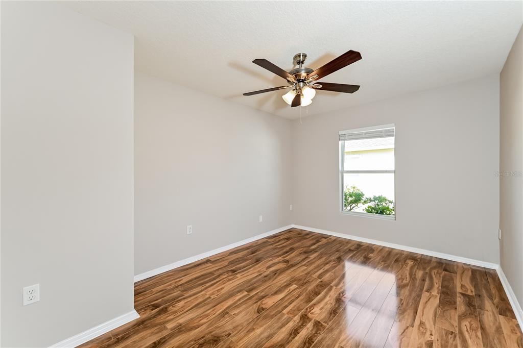149 Springberry Court Daytona Beach, FL 32124 - Photo 6 of 16 a view of an empty room and window