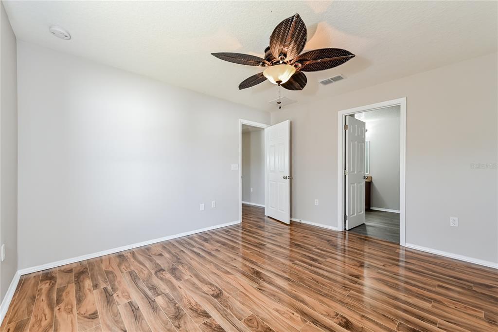 149 Springberry Court Daytona Beach, FL 32124 - Photo 7 of 16 a view of empty room with wooden floor
