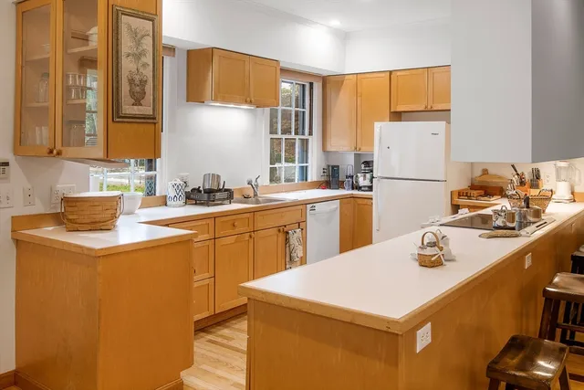 a kitchen with a sink a stove and refrigerator