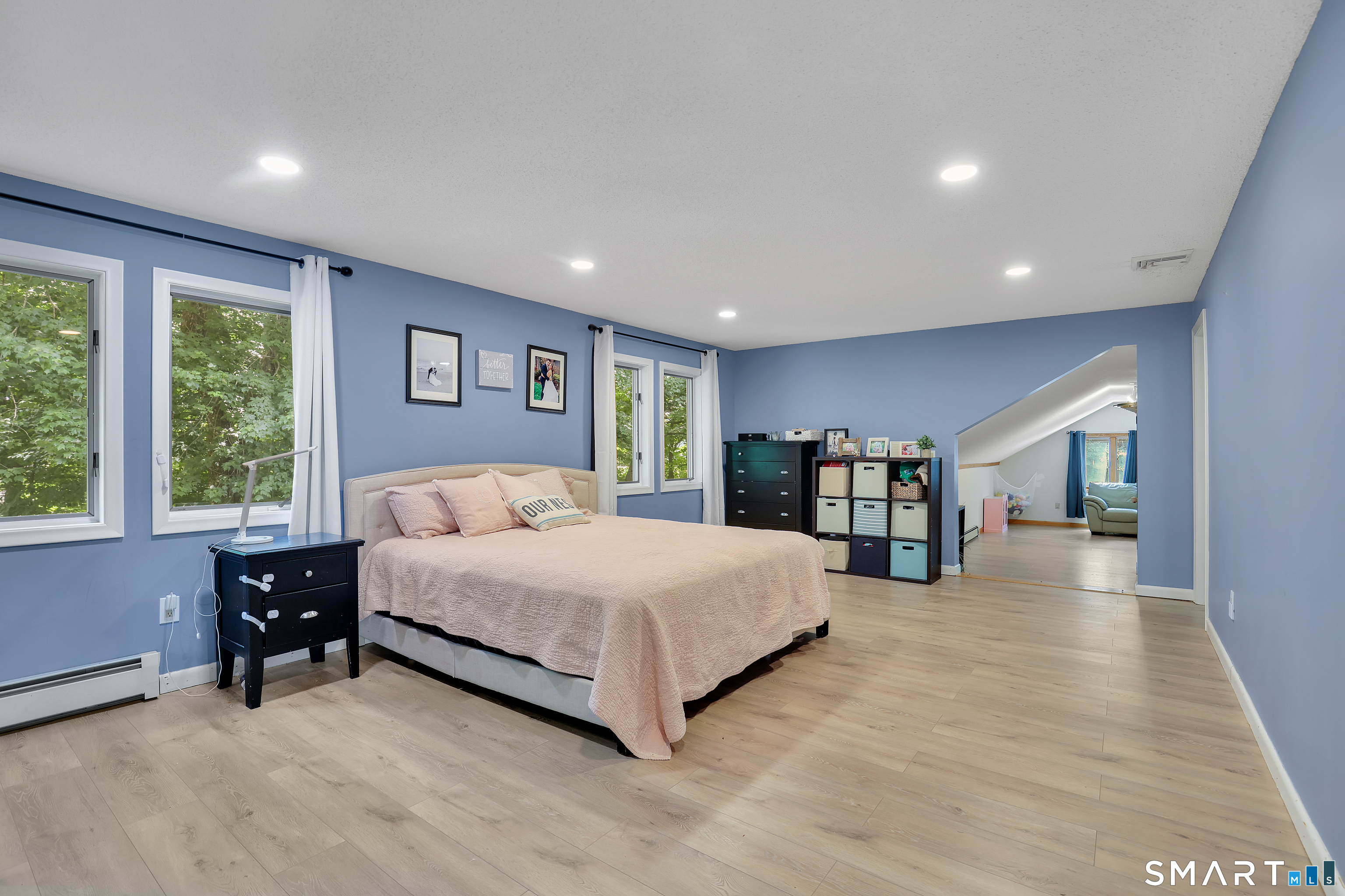 8 Pond View Road Bolton, CT 06043 - Photo 20 of 37 Spacious primary bedroom that leads to an expansive bonus room.