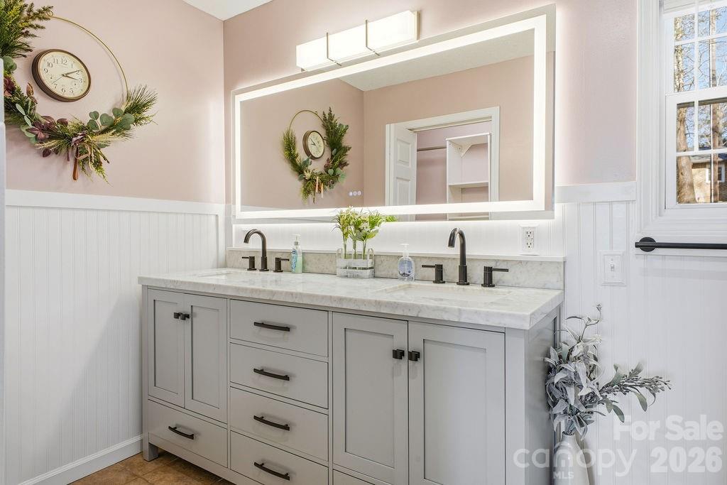 1113 Brookside Camp Road Hendersonville, NC 28792 - Photo 11 of 20 a bathroom with a sink and a mirror