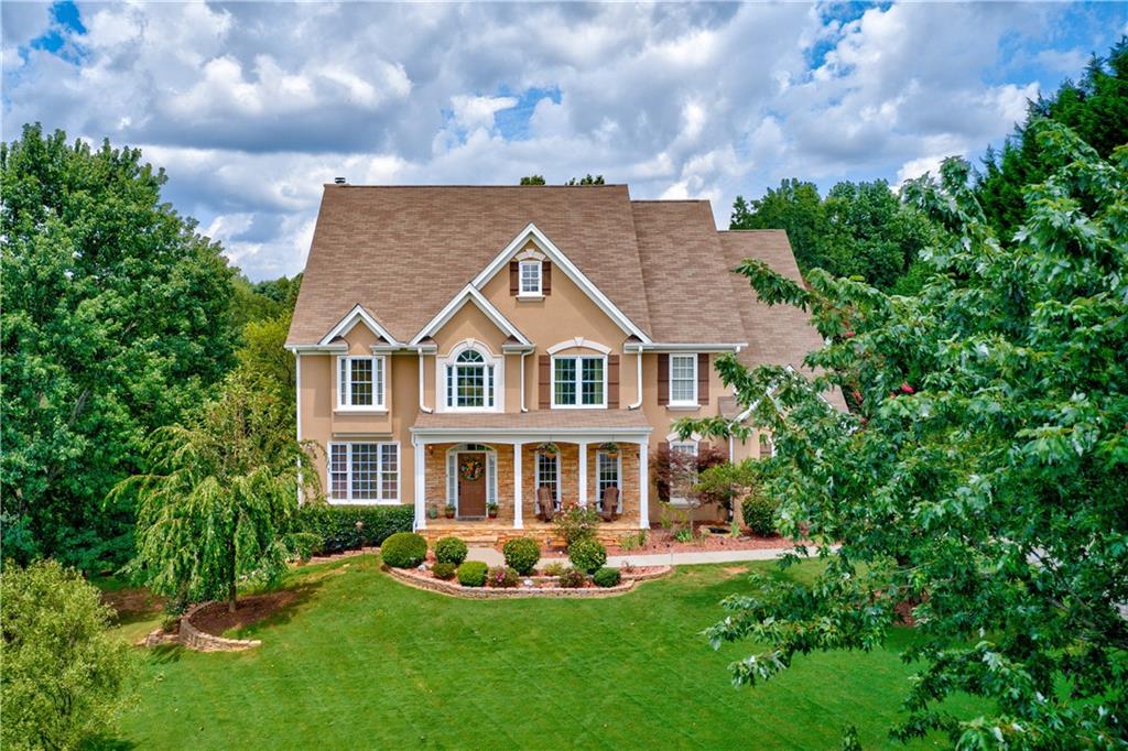 Estate home on 2+ beautifully lanscaped and wooded acres. 
