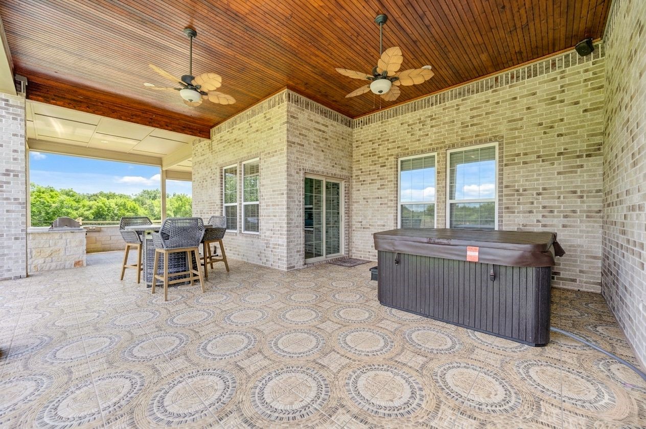 21038 Angus Drive Cleveland, TX 77328 - Photo 45 of 49 a view of a patio with a table and chairs in patio