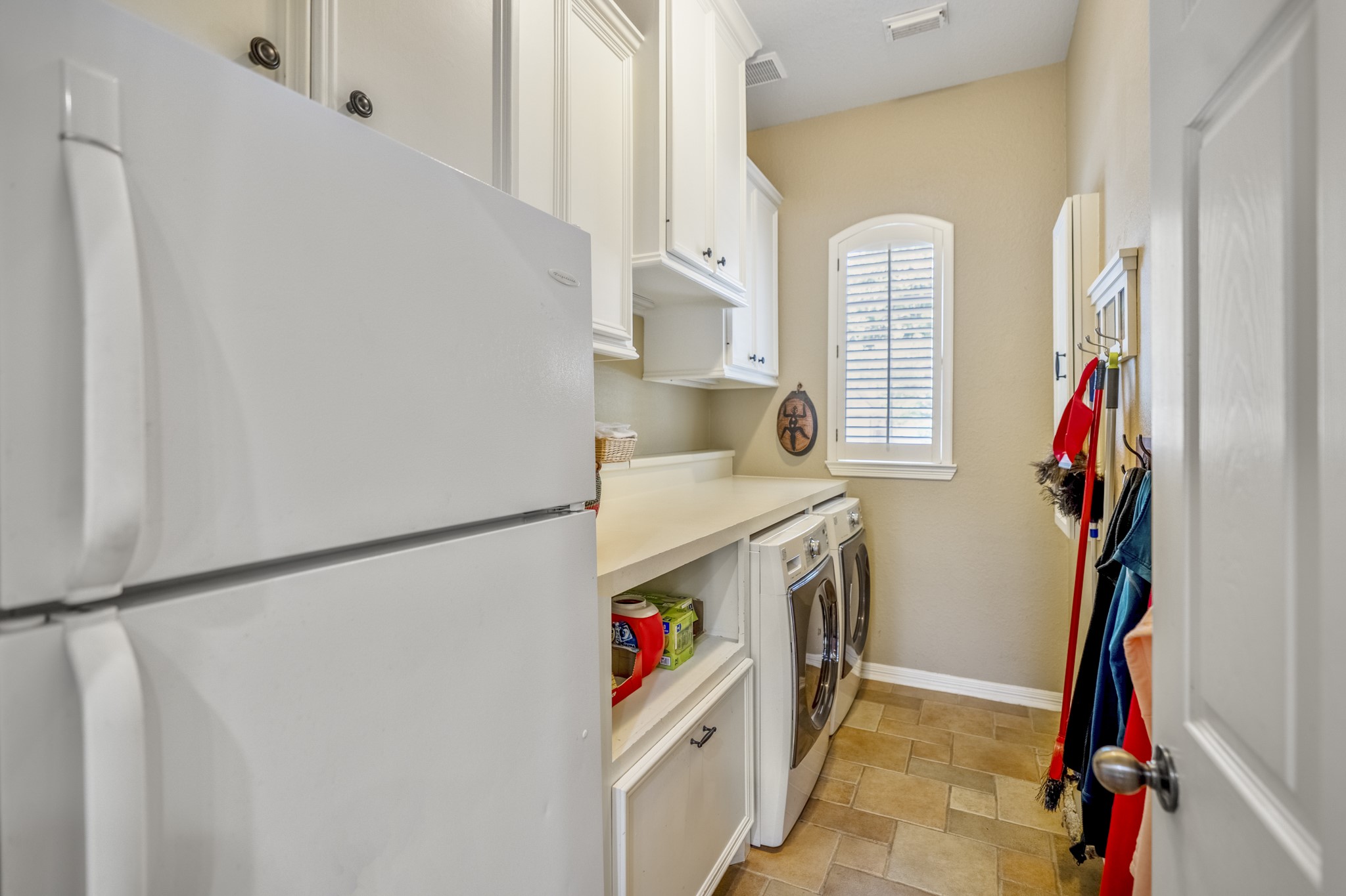 1438 Hatchmere Place Spring, TX 77379 - Photo 15 of 50 There is a large laundry room with ample space for storage, an overflow refrigerator and even has a window that allows natural light into the room. All Appliances are included. 2 Refrigerators, Microwave, Dishwasher, Washer and Dryer